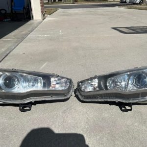 Buy Mitsubishi Evo X OEM HID headlights, used in good working condition for 2008-2015 Evolution X models. Genuine Mitsubishi factory HID assemblies.
